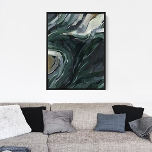 May include: Abstract painting with swirling green, blue, and white colors. The painting has a textured look and is framed in black.