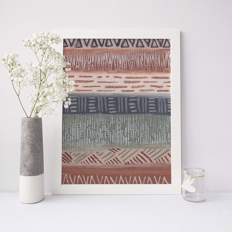 May include: A framed print with a geometric pattern in shades of brown, green, and blue. The pattern is made up of lines, triangles, and squares.