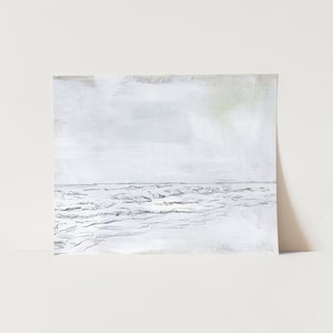 May include: A black and white sketch of a seascape with waves crashing on the shore. The sky is a light gray with a hint of blue.