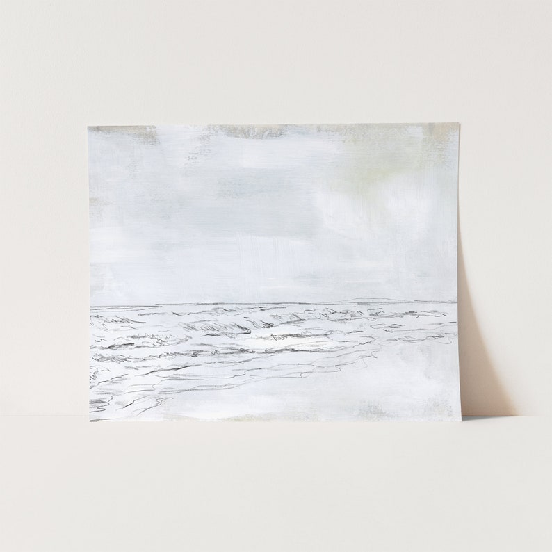 May include: A black and white sketch of a seascape with waves crashing on the shore. The sky is a light gray with a hint of blue.