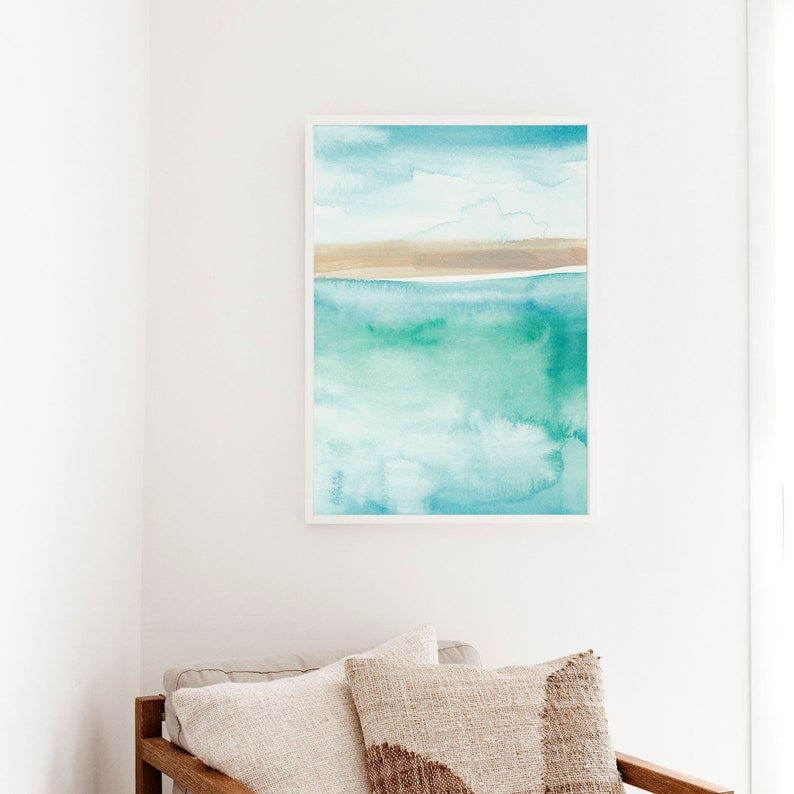 May include: Abstract watercolor painting of a seascape with a light blue sky, white clouds, a thin brown sandbar, and turquoise water.