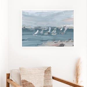 May include: Abstract painting depicting a seascape with white sailboats on a blue-grey body of water. The sky is a light grey with hints of pink.