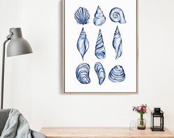 May include: A framed print featuring nine blue watercolor illustrations of various seashells. The artwork showcases a range of shell shapes and sizes, with detailed shading and a white background. The print is displayed in a light-colored wooden frame.