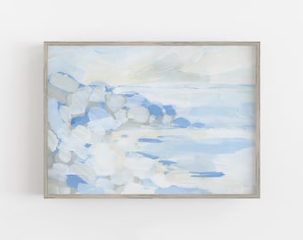 May include: Abstract landscape painting in a light blue and white color palette. The artwork depicts a coastal scene with brushstrokes suggesting rocks and water. The painting is framed in a light wood frame.