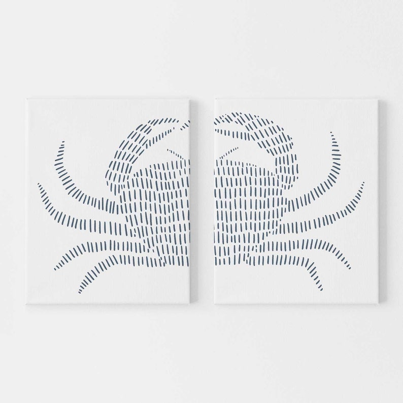 May include: Two white canvases with a blue line drawing of a crab on each. The crab is drawn with a series of short, parallel lines.