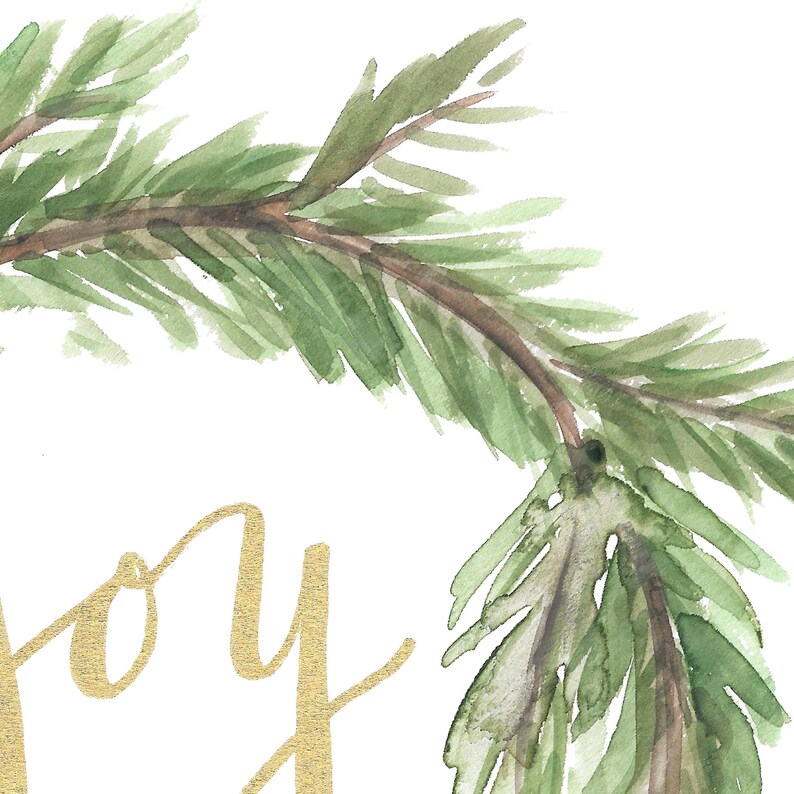 May include: Watercolor painting of a green pine branch with gold text that says "Joy". The artwork has a white background and is a close-up of the branch and text. The painting has a festive, holiday theme.