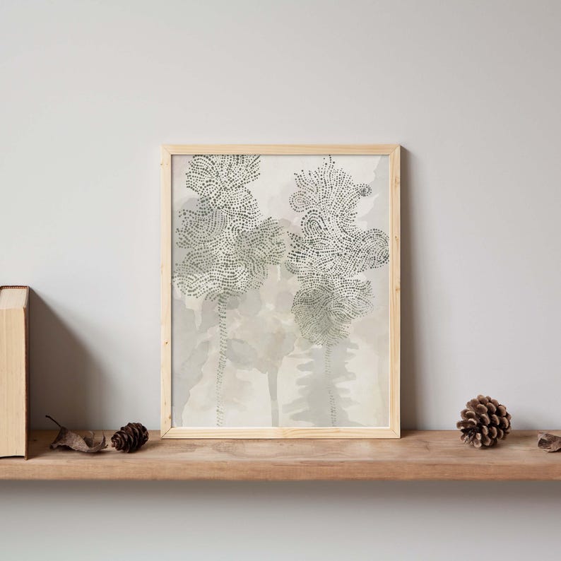 May include: A framed print of a watercolor painting featuring two stylized trees in shades of green and gray on a light beige background.