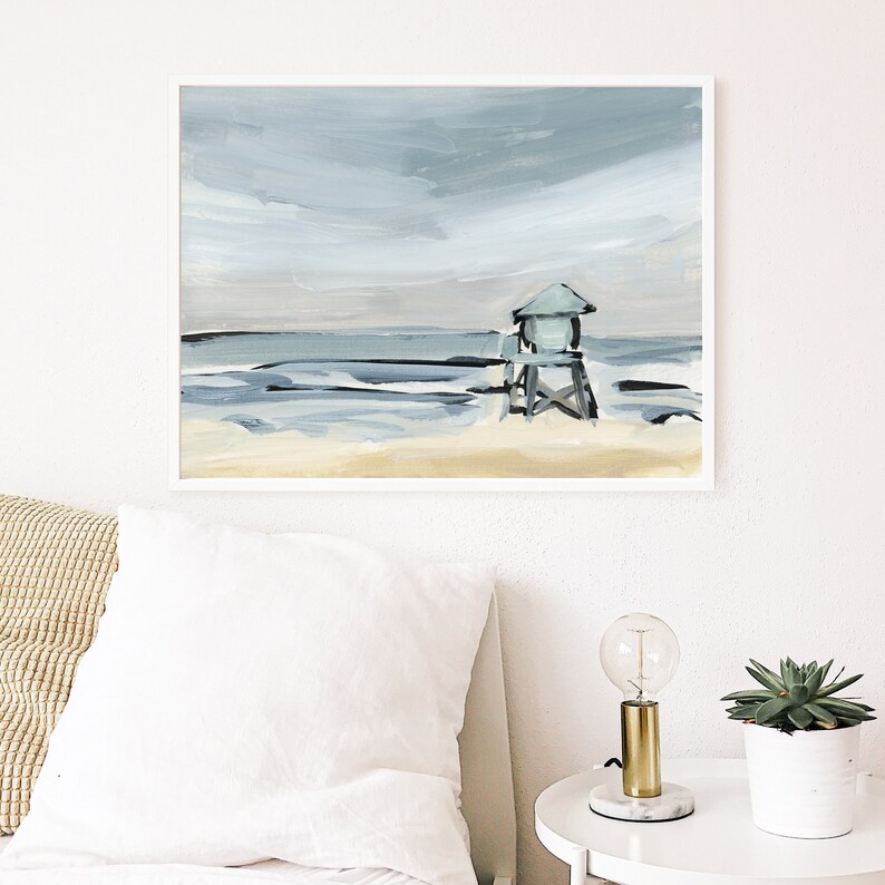May include: A painting of a beach scene with a lifeguard stand in the distance. The sky is a light blue with white clouds, and the water is a dark blue with white waves. The sand is a light brown.