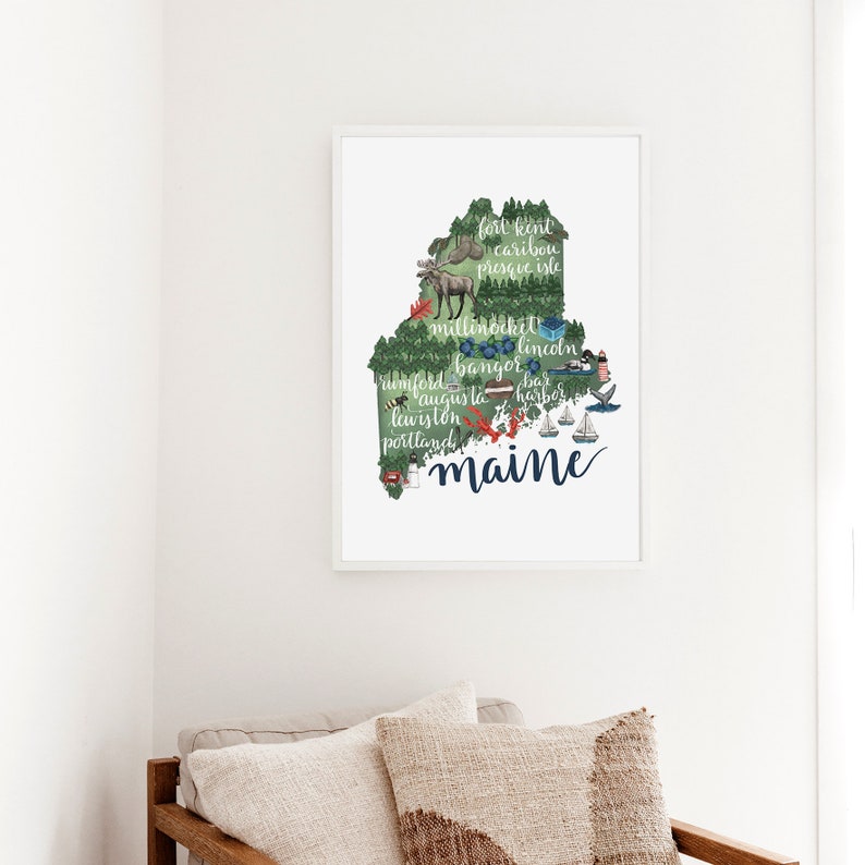 May include: A green and blue illustration of the state of Maine with the names of cities and towns written on it. The text "Maine" is written in large, stylized lettering at the bottom of the image.