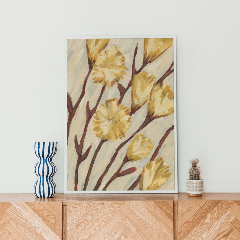 May include: A framed painting of yellow flowers with brown stems on a light beige background.