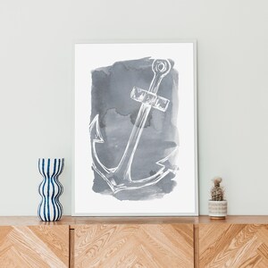 May include: A white anchor illustration on a gray watercolor background. The anchor is a simple line drawing with a rope detail. The watercolor background is a soft gray with a slightly textured look.