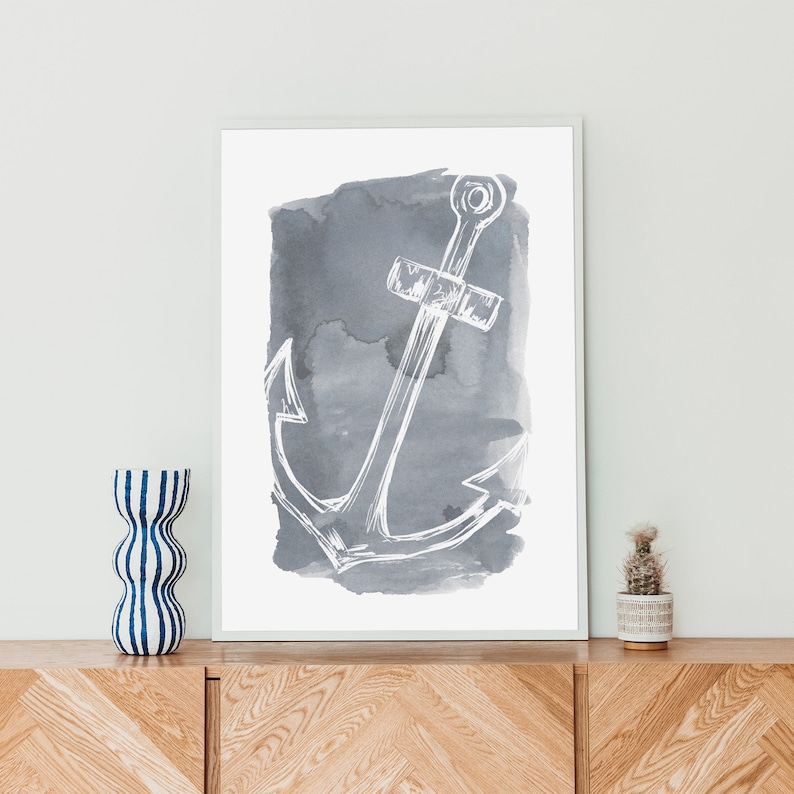 May include: A white anchor illustration on a gray watercolor background. The anchor is a simple line drawing with a rope detail. The watercolor background is a soft gray with a slightly textured look.
