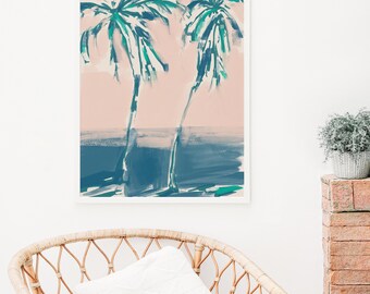May include: A framed abstract painting of two palm trees in shades of green and blue against a pink background. The painting has a watercolor-like style and evokes a tropical beach scene.