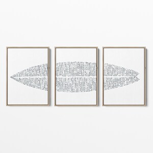 May include: A set of three framed prints with a white background and a black and white abstract design. The design is made up of small dots that form a pattern of overlapping shapes.