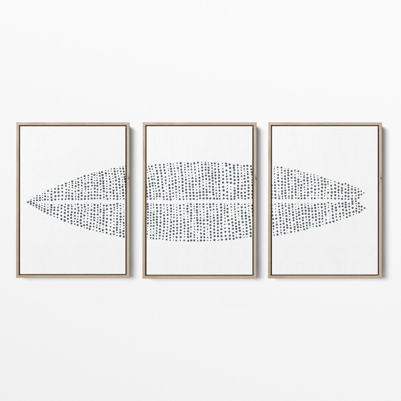 May include: A set of three framed prints with a white background and a black and white abstract design. The design is made up of small dots that form a pattern of overlapping shapes.