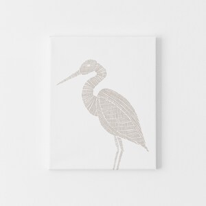 May include: A beige line drawing of a heron on a white background.