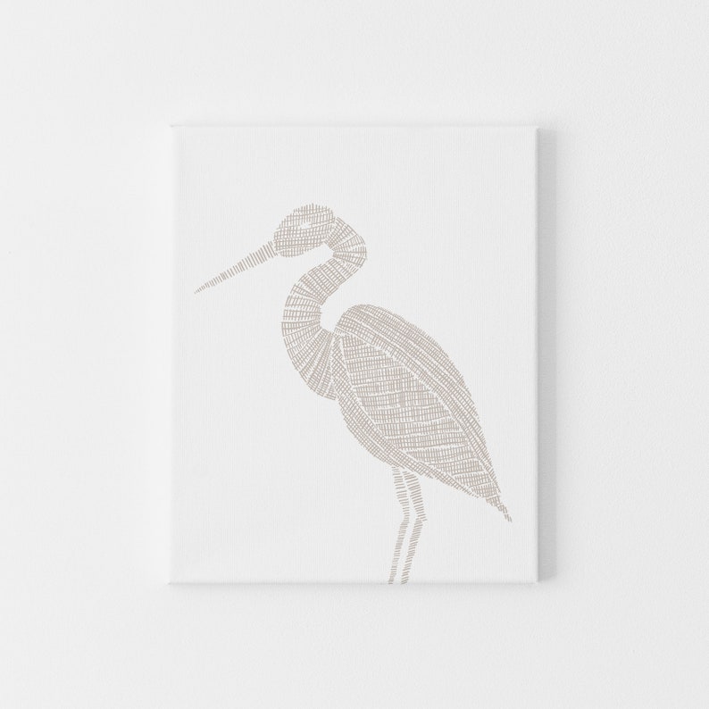 May include: A beige line drawing of a heron on a white background.