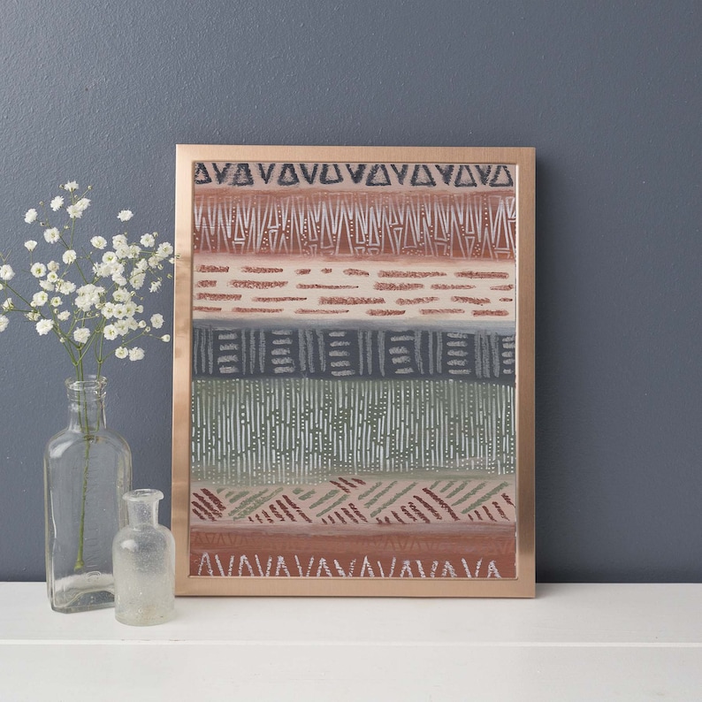 May include: A framed print with a geometric pattern in shades of brown, gray, and green. The frame is a copper color.