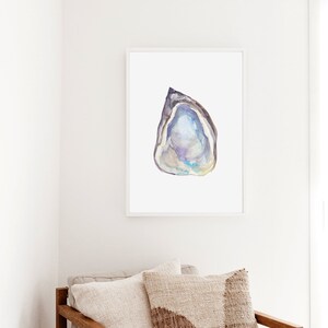May include: Watercolor painting of a purple and blue seashell with a white background.