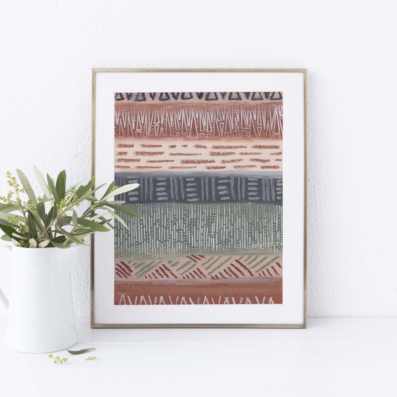 May include: A framed print with a geometric pattern in shades of brown, green, and gray. The pattern is made up of lines, triangles, and squares.