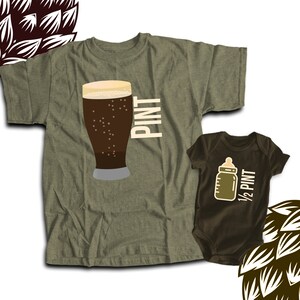 May include: Olive green adult t-shirt with a graphic of a pint of beer and the word "PINT" in white. A brown baby onesie features a baby bottle graphic and the text "1/2 PINT".