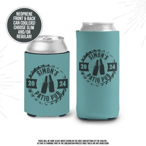 May include: Two turquoise blue neoprene can coolers with a black and white design. The design features a bottle cap with the text "Simon's Patio Pub" and the numbers "20" and "24".
