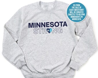 Sudadera Minnesota Strong: acogedora, unisex, con detalle de llama de vela