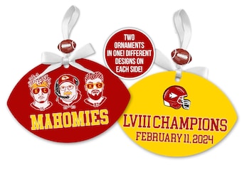May include: Two-sided football-shaped ornament. One side is red with the word "MAHOMIES" and illustrations of three people. The other side is yellow with a red helmet and the text "LVIII CHAMPIONS FEBRUARY 11, 2024".