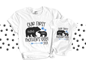 May include: White t-shirt and onesie with black bear silhouettes and the text "Our First Mother's Day! 2021". The bear silhouettes are labeled "Mama" and "Baby".