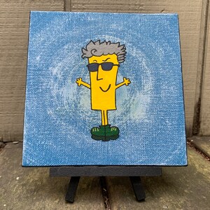 May include: A yellow stick figure with gray hair and sunglasses is painted on a blue canvas. The figure is wearing green shoes and has a happy expression.