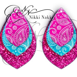 May include: A pair of layered teardrop earrings. The earrings feature a paisley pattern in pink and white, layered over a turquoise layer, and finished with a glittery pink bottom layer. The earrings are designed with a hole at the top for hanging.