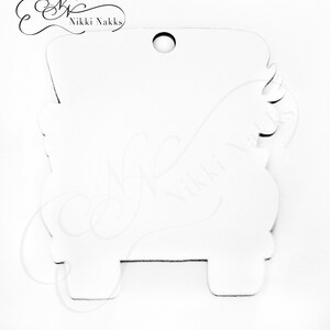 May include: White wooden cutout of a small truck with a hole at the top for hanging. The truck has a rounded bed and a simple design.