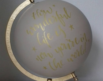 Hand painted globe with song lyrics.