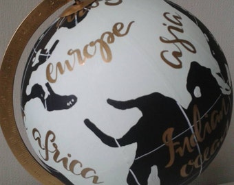 Hand painted globe. Unique designs and phrases perfect gift for those who love to travel.