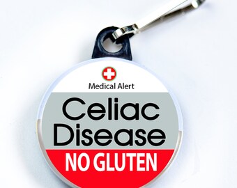 May include: A round, white zipper pull with a red, white, and gray design. The zipper pull has a red cross and the text "Medical Alert" in black. The text "Celiac Disease" is in black on a gray background. The text "NO GLUTEN" is in white on a red background.