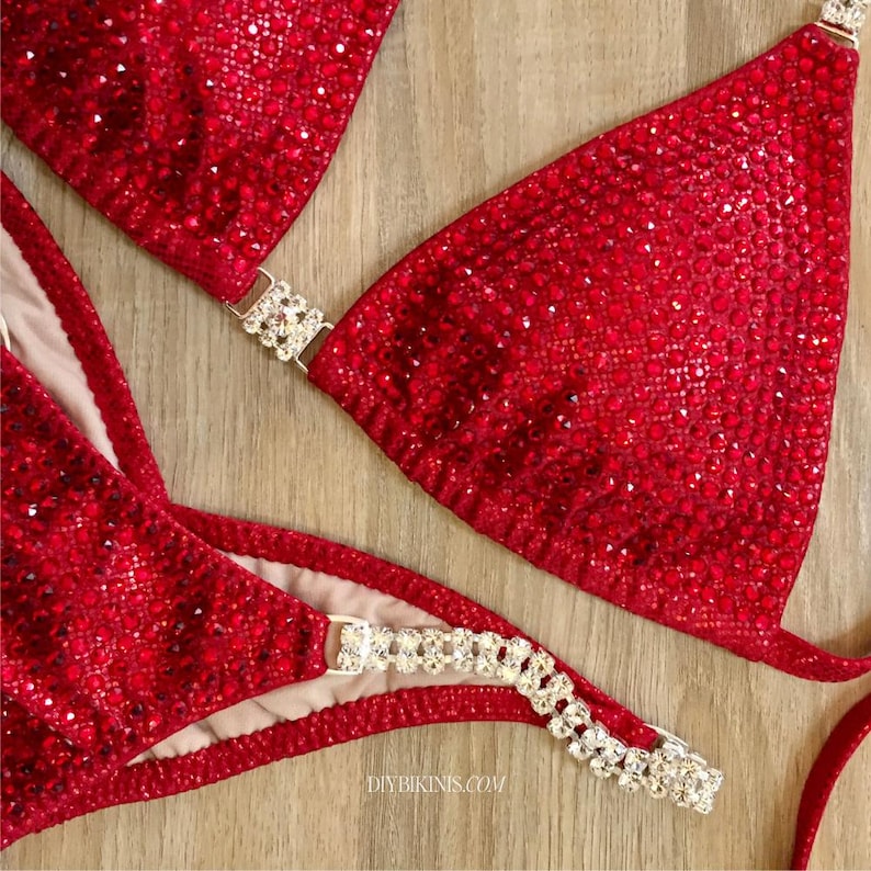 Red competition bikini on a table, made using this PDF Sewing pattern