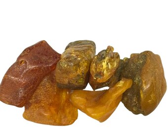 100% AMBER  - TUMBLESTONE / CRYSTAL with an information card in an organza bag.  Amber Crystal, Natural Amber. Genuine Amber.