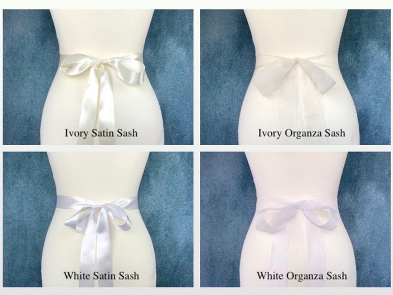 May include: Four white sashes, two made of satin and two made of organza. The sashes are tied in a bow around a white dress form. The sashes are labeled "Ivory Satin Sash", "Ivory Organza Sash", "White Satin Sash", and "White Organza Sash".