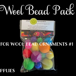 May include: A clear plastic bag filled with colorful wool beads. The bag is labeled "Wool Bead Pack" and "For Wool Bead Ornaments #1". The bag also has a small label with the text "EWE NIVERSITY by Susan M. Wigginschotle".
