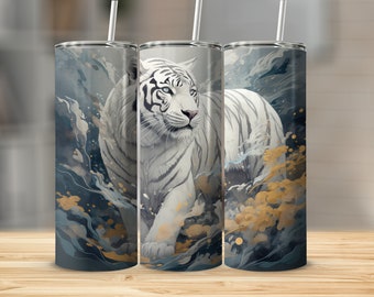 May include: A white tiger with black stripes walks through a blue and gold abstract pattern on a stainless steel tumbler.