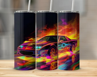 May include: A stainless steel tumbler with a colorful image of a sports car driving through flames. The car is painted in shades of purple, orange, and blue, with a black background.