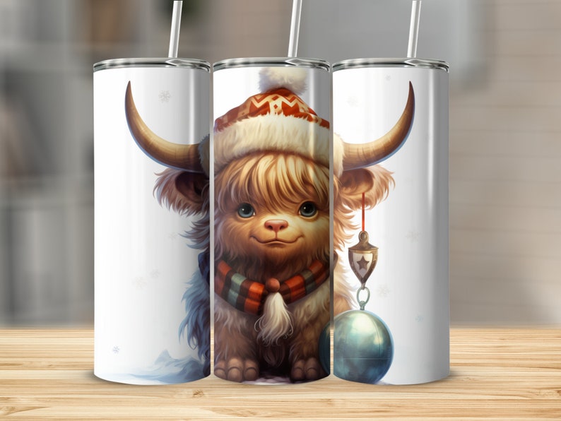 May include: Three white 20oz stainless steel tumblers with a cute cartoon Highland cow wearing a Santa hat and scarf. The cow has a whimsical, festive design and is holding an ornament. The tumblers are perfect for Christmas gifts or winter-themed events. Each tumbler features a straw and lid.