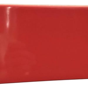 May include: A rectangular, glossy, solid red object. The object has a smooth, reflective surface and a simple, modern design. The shape is a long rectangle, with a consistent red colour throughout.