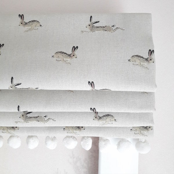 Jumping Hares  Blackout lined Roman Blind with Pom Pom Trim