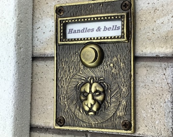 Solid Brass Doorbell Push Button with Bas Relief Lion Head in Antique Brass Gloss Finish.