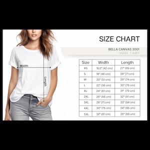 May include: A white Bella Canvas 3001 unisex t-shirt. The image includes a size chart with measurements in inches and centimeters. The chart lists sizes XS to 5XL, with widths ranging from 16.5 inches (42 cm) to 32 inches (81 cm).