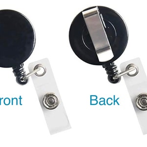 May include: Black retractable badge holder with a clip on the back and a clear plastic badge holder. The front of the badge holder has a black circle with a smooth surface. The back of the badge holder has a silver clip.