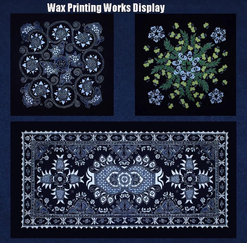 May include: A display of wax printing works. The image shows three fabric pieces with detailed white and blue patterns on a black backdrop. The top left piece has a swirling floral design, the top right has a floral design, and the bottom piece is rectangular with a detailed border.