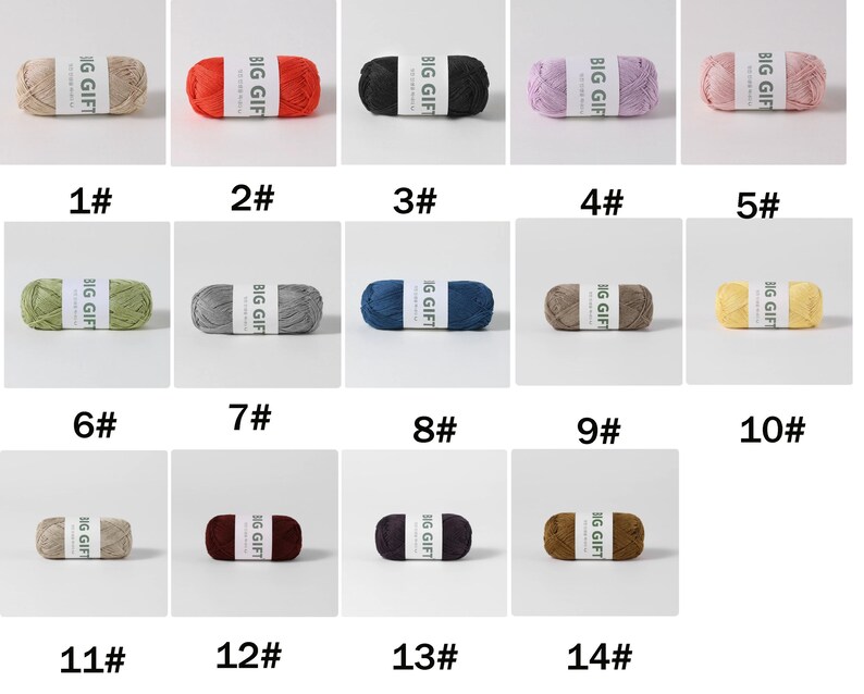 May include: A collection of fourteen individual skeins of yarn, each wrapped with a white paper band labeled BIG GIFT. The yarn colors include beige, red, black, lavender, pink, green, gray, blue, brown, yellow, tan, burgundy, dark purple, and dark brown.
