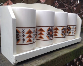 Spice salt cellars set of 4 in ceramic on wall shelf with vintage Ukraine pattern 1980